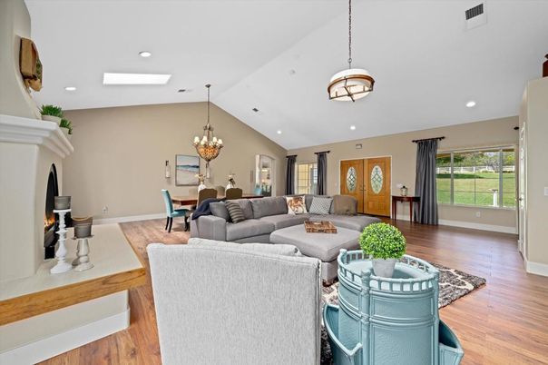 Chandelier, Dining room, Fireplace, Interior, Living room, Pendant Lights, Recessed Lighting, Wood Texture Flooring