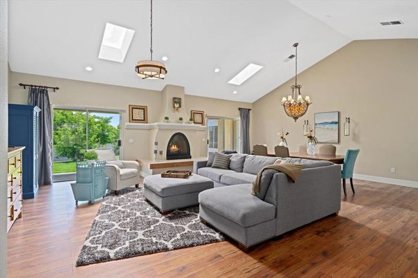 Chandelier, Dining room, Fireplace, Interior, Living room, Pendant Lights, Recessed Lighting, Wood Texture Flooring