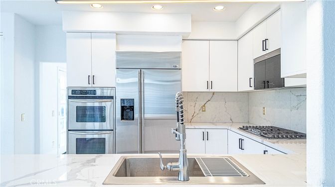 Interior, Kitchen, Marble Walls, Recessed Lighting, Stainless Steel Appliances