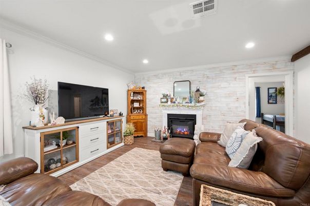 Fireplace, Interior, Living room, Recessed Lighting, Stone Walls, Wood Texture Flooring
