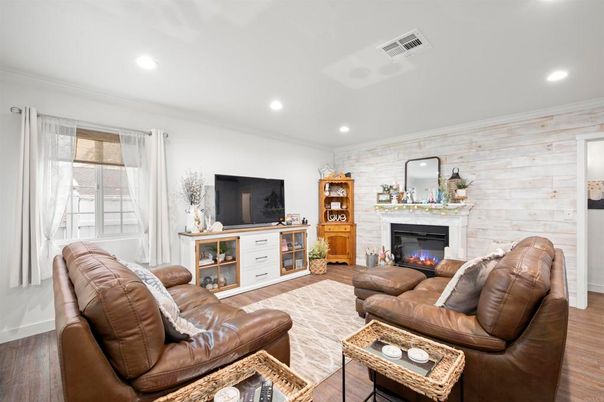 Fireplace, Interior, Living room, Recessed Lighting, Stone Walls, Wood Texture Flooring, Wooden Walls