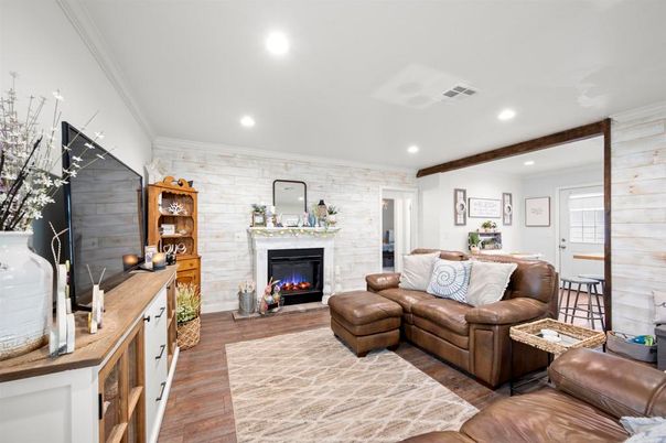 Fireplace, Interior, Living room, Recessed Lighting, Stone Walls, Wood Texture Flooring