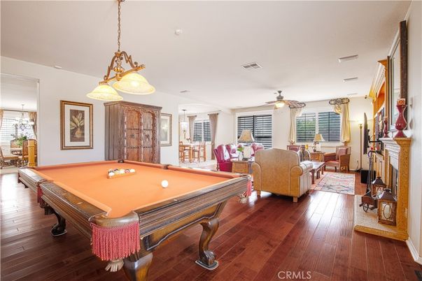 Billiard Table, Fireplace, Game Room, Interior, Living room, Pendant Lights, Wood Texture Flooring