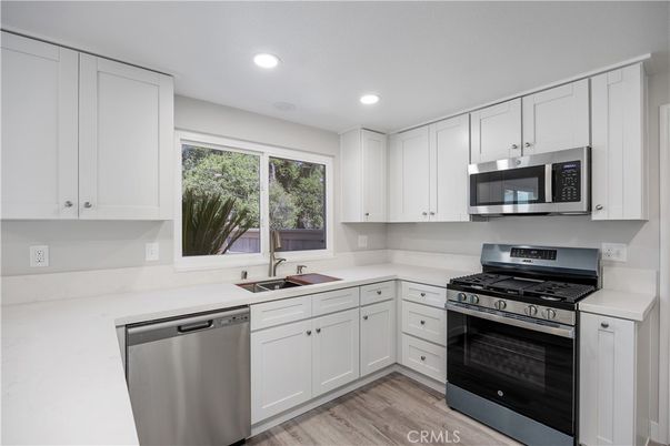 Interior, Kitchen, Recessed Lighting, Stainless Steel Appliances, Wood Texture Flooring