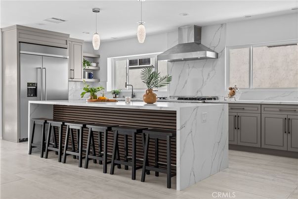 Interior, Kitchen, Marble Walls, Pendant Lights, Recessed Lighting, Stainless Steel Appliances, Wood Texture Flooring