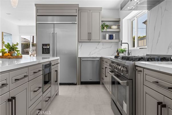 Interior, Kitchen, Marble Walls, Recessed Lighting, Stainless Steel Appliances