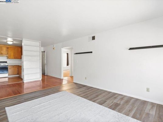 Empty room, Interior, Kitchen, Stainless Steel Appliances, Wood Texture Flooring