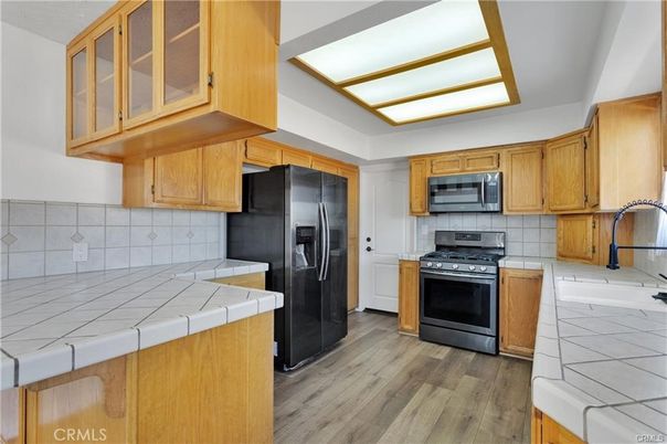 Interior, Kitchen, Stainless Steel Appliances, Tile Countertops, Wood Texture Flooring