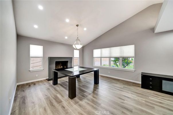 Fireplace, Game Room, Interior, Pendant Lights, Recessed Lighting, Wood Texture Flooring