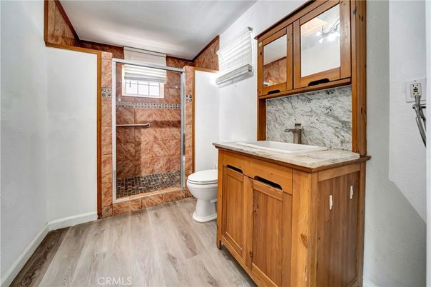 Bathroom, Glass Shower, Interior, Marble Walls, Wood Texture Flooring