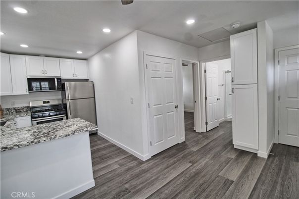 Interior, Kitchen, Recessed Lighting, Stainless Steel Appliances, Wood Texture Flooring