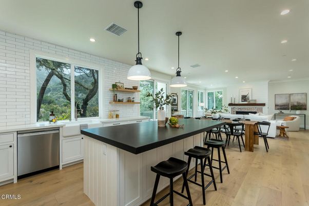 Dining room, Fireplace, Interior, Kitchen, Living room, Pendant Lights, Recessed Lighting, Stainless Steel Appliances, Stone Walls, Wood Texture Flooring