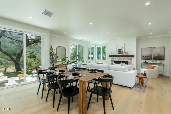 Dining room, Fireplace, Interior, Living room, Recessed Lighting, Wood Texture Flooring