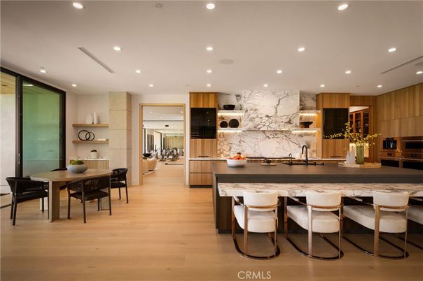 Dining room, Interior, Kitchen, Marble Walls, Recessed Lighting, Stainless Steel Appliances, Wood Texture Flooring