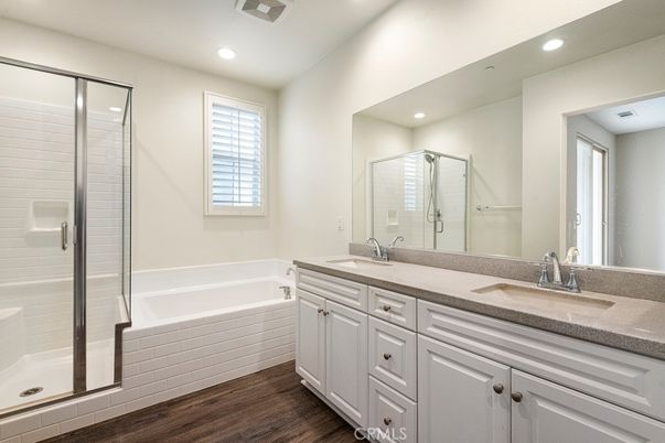 Bathroom, Dual Sink Vanities, Glass Shower, Interior, Recessed Lighting, Wood Texture Flooring