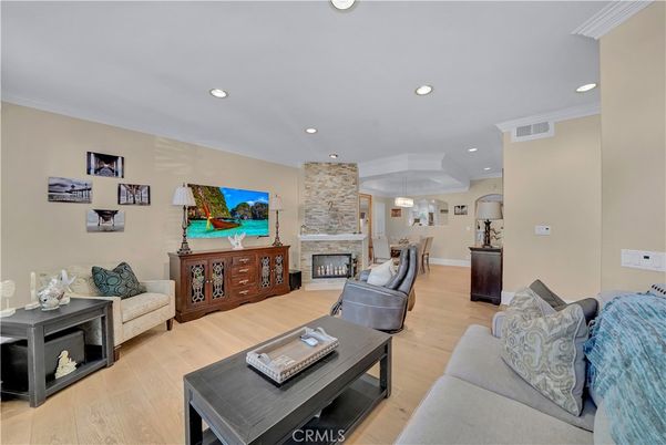 Fireplace, Interior, Living room, Recessed Lighting, Stone Walls, Wood Texture Flooring