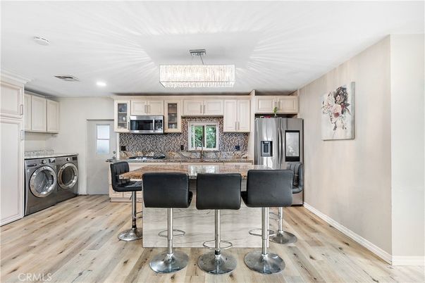 Interior, Kitchen, Recessed Lighting, Stainless Steel Appliances, Washer, Wood Texture Flooring