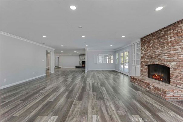 Empty room, Fireplace, Interior, Recessed Lighting, Stone Walls, Wood Texture Flooring