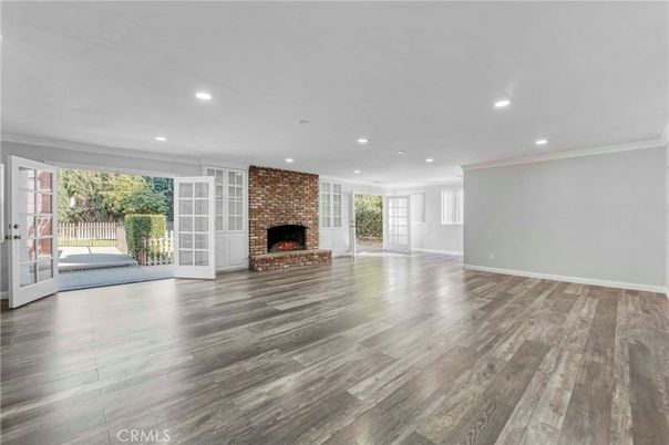 Empty room, Fireplace, Interior, Recessed Lighting, Stone Walls, Wood Texture Flooring