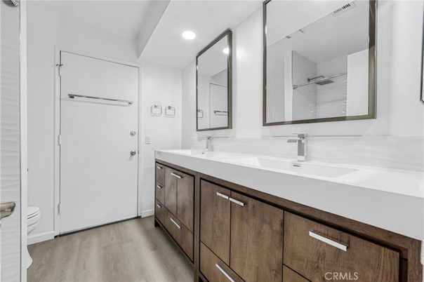 Bathroom, Dual Sink Vanities, Interior, Recessed Lighting, Wood Texture Flooring