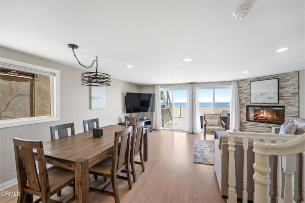 Dining room, Fireplace, Interior, Living room, Pendant Lights, Recessed Lighting, Stone Walls, Wood Texture Flooring