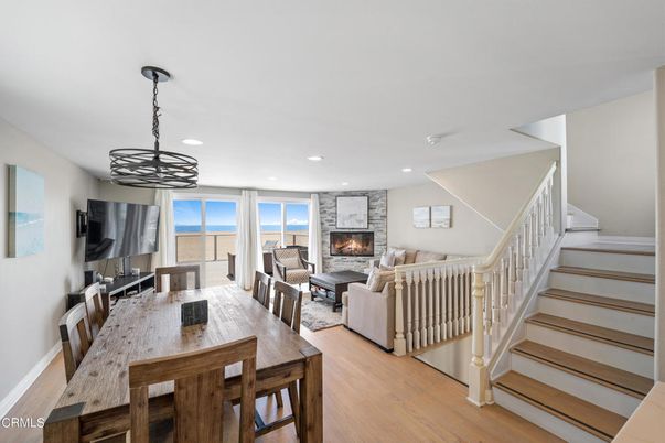 Dining room, Fireplace, Interior, Living room, Pendant Lights, Recessed Lighting, Wood Texture Flooring
