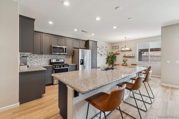 Chandelier, Dining room, Interior, Kitchen, Pendant Lights, Recessed Lighting, Stainless Steel Appliances, Wood Texture Flooring