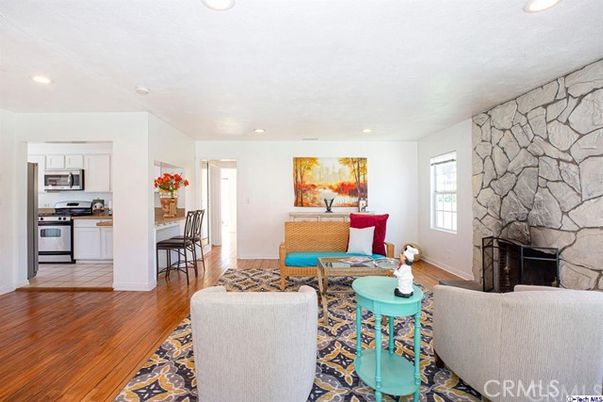 Fireplace, Interior, Kitchen, Living room, Recessed Lighting, Stainless Steel Appliances, Stone Walls, Wood Texture Flooring