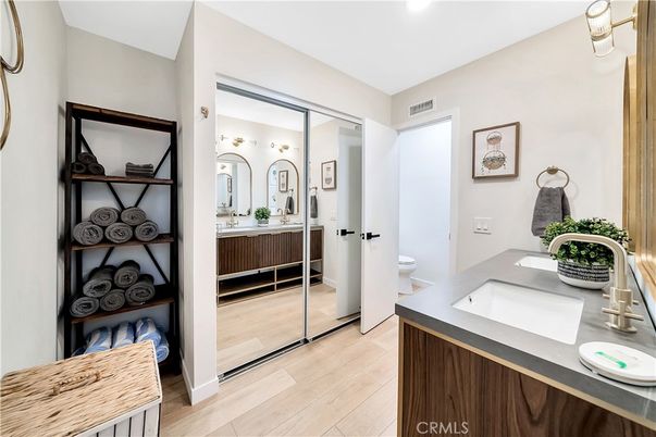 Bathroom, Dual Sink Vanities, Interior, Recessed Lighting, Wood Texture Flooring