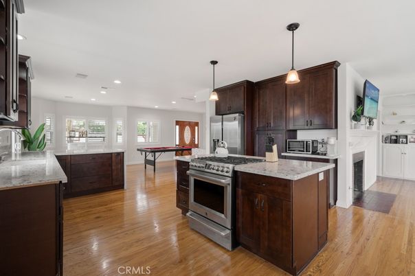 Fireplace, Interior, Kitchen, Pendant Lights, Recessed Lighting, Stainless Steel Appliances, Wood Texture Flooring