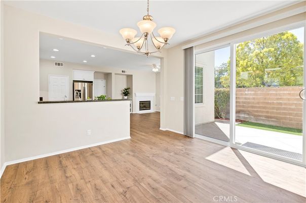 Chandelier, Empty room, Interior, Kitchen, Recessed Lighting, Stainless Steel Appliances, Wood Texture Flooring