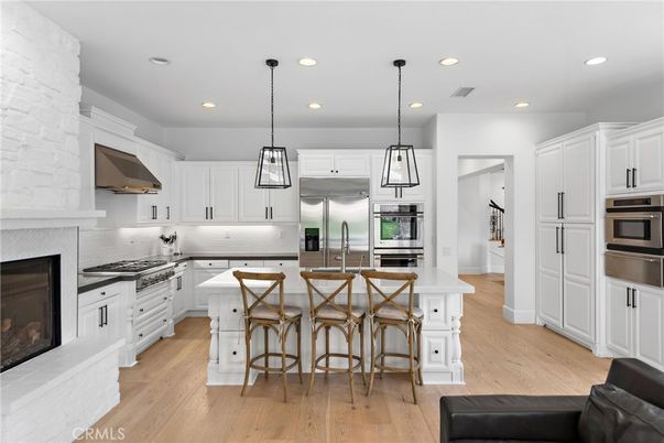Fireplace, Interior, Kitchen, Pendant Lights, Recessed Lighting, Stainless Steel Appliances, Wood Texture Flooring
