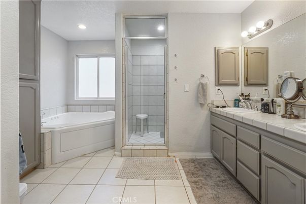 Bathroom, Dual Sink Vanities, Glass Shower, Interior, Recessed Lighting, Tile Countertops