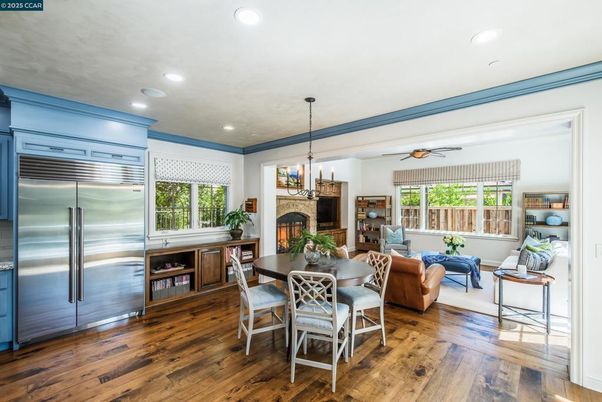 Dining room, Fireplace, Interior, Kitchen, Living room, Pendant Lights, Recessed Lighting, Stainless Steel Appliances, Wood Texture Flooring