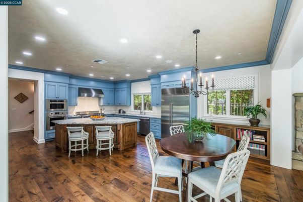 Chandelier, Dining room, Interior, Kitchen, Pendant Lights, Recessed Lighting, Stainless Steel Appliances, Wood Texture Flooring
