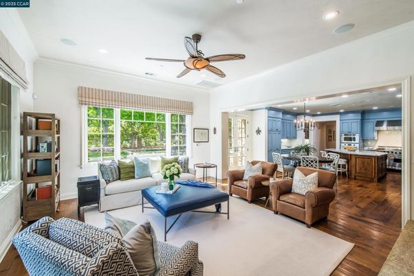 Chandelier, Dining room, Interior, Kitchen, Living room, Pendant Lights, Recessed Lighting, Stainless Steel Appliances, Wood Texture Flooring