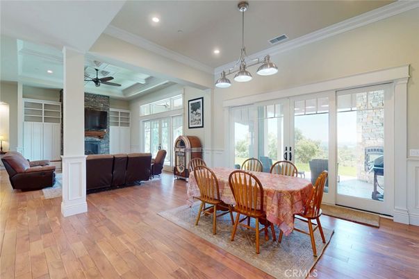 Dining room, Fireplace, Interior, Living room, Pendant Lights, Recessed Lighting, Wood Texture Flooring