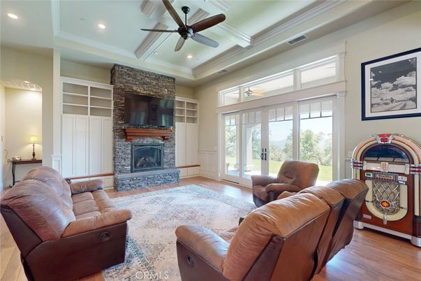 Fireplace, Interior, Living room, Recessed Lighting, Stone Walls, Wood Texture Flooring