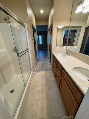 Bathroom, Dual Sink Vanities, Glass Shower, Interior, Recessed Lighting, Wood Texture Flooring