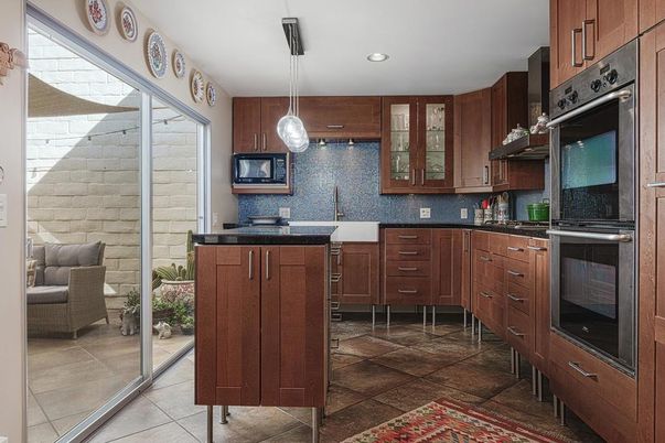 Interior, Kitchen, Pendant Lights, Recessed Lighting, Stainless Steel Appliances, Stone Walls