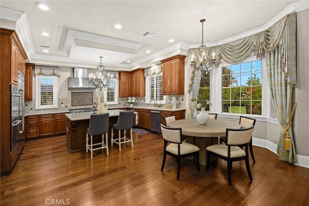 Chandelier, Dining room, Interior, Kitchen, Recessed Lighting, Stainless Steel Appliances, Wood Texture Flooring