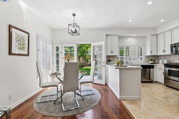 Dining room, Interior, Kitchen, Pendant Lights, Recessed Lighting, Stainless Steel Appliances, Wood Texture Flooring
