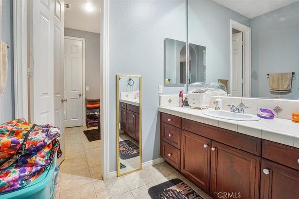 Bathroom, Dual Sink Vanities, Interior, Recessed Lighting, Tile Countertops