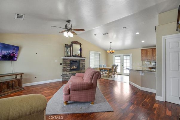 Chandelier, Dining room, Fireplace, Interior, Kitchen, Living room, Recessed Lighting, Wood Texture Flooring