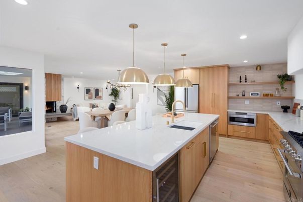 Dining room, Fireplace, Interior, Kitchen, Living room, Pendant Lights, Recessed Lighting, Stainless Steel Appliances, Wood Texture Flooring