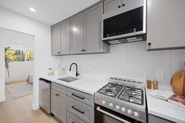 Interior, Kitchen, Recessed Lighting, Stainless Steel Appliances, Wood Texture Flooring