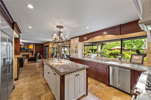 Chandelier, Dining room, Fireplace, Interior, Kitchen, Recessed Lighting, Stainless Steel Appliances