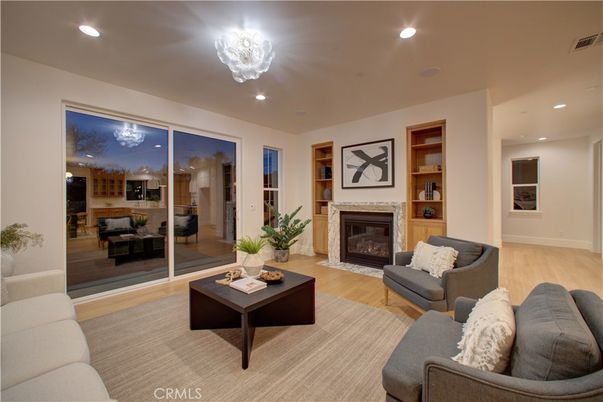Chandelier, Fireplace, Interior, Living room, Recessed Lighting, Wood Texture Flooring