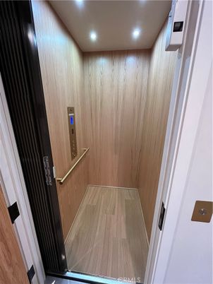 Elevator, Interior, Recessed Lighting, Wood Texture Flooring, Wooden Walls