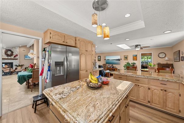 Dining room, Fireplace, Interior, Kitchen, Pendant Lights, Recessed Lighting, Stainless Steel Appliances, Wood Texture Flooring
